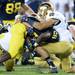 Michigan running back Fitzgerald Toussaint is stopped by Notre Dame safety Austin Collinsworth during the first half at Michigan Stadium on Saturday, September 7, 2013. Melanie Maxwell | AnnArbor.com